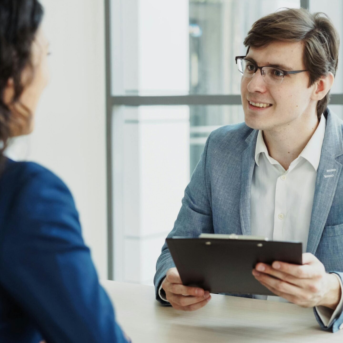 Business professionals engaged in a meeting, highlighting collaboration.